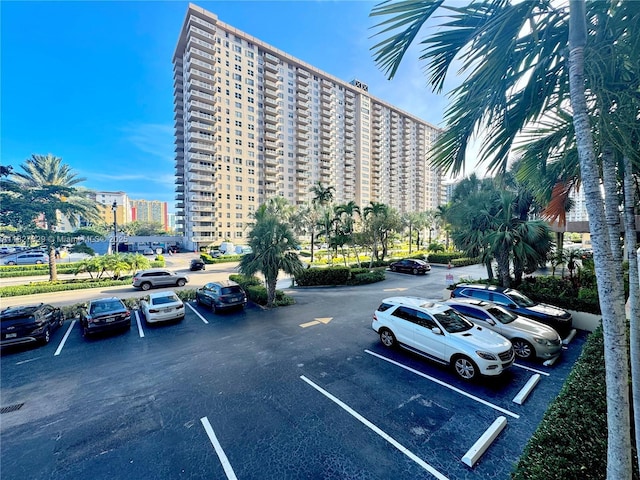 251 174th St Unit 115, Sunny Isles Beach, FL 33160 - view of property featuring uncovered parking
