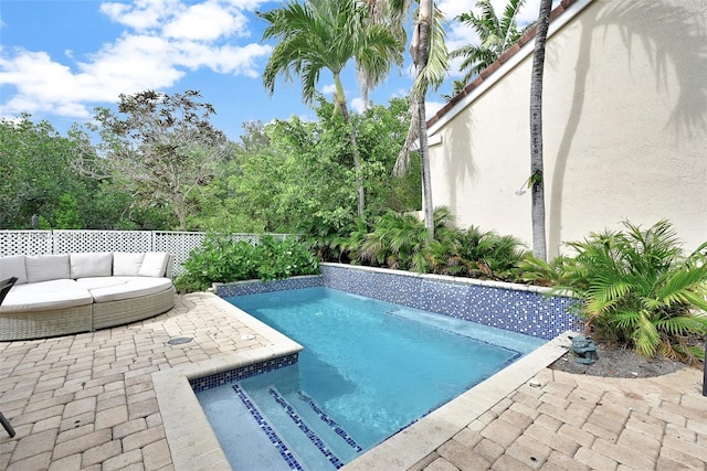 1151 W Lake St, Hollywood, FL 33019 - view of pool featuring outdoor lounge area, a patio area, and a fenced backyard