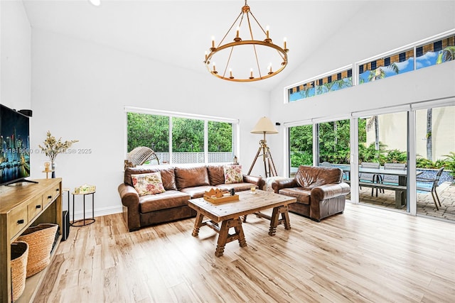 1151 W Lake St, Hollywood, FL 33019 - living room with high vaulted ceiling, a chandelier, and wood finished floors