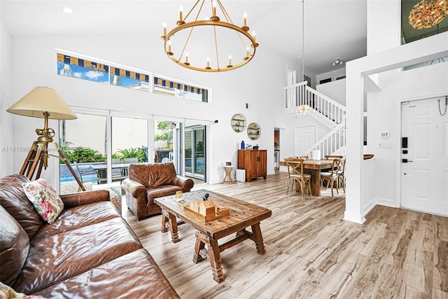 1151 W Lake St, Hollywood, FL 33019 - living room with high vaulted ceiling, stairs, a chandelier, and wood finished floors