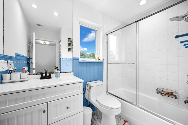 1151 W Lake St, Hollywood, FL 33019 - full bath featuring vanity, enclosed tub / shower combo, a wainscoted wall, recessed lighting, and tile patterned floors