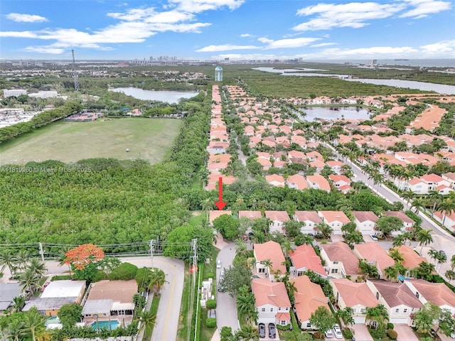 1151 W Lake St, Hollywood, FL 33019 - aerial view of property and surrounding area featuring a nearby body of water and nearby suburban area