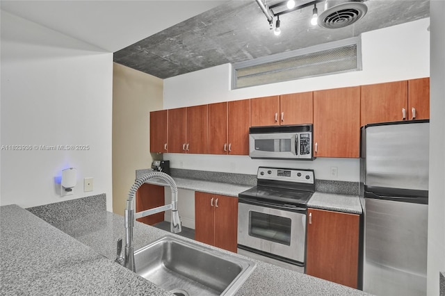 455 NE 25th St Unit 609, Miami, FL 33137 - kitchen with appliances with stainless steel finishes and brown cabinets