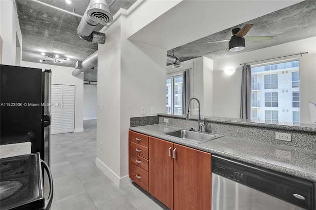 455 NE 25th St Unit 609, Miami, FL 33137 - kitchen with stainless steel dishwasher, ceiling fan, stove, and freestanding refrigerator