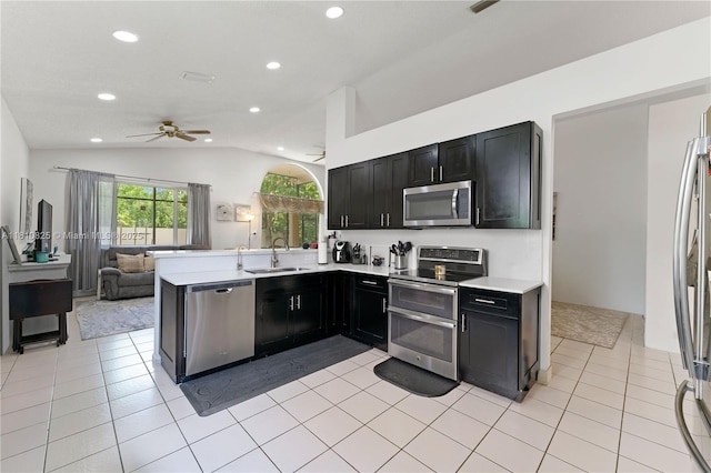 6421 Lake Tern Ln, Coconut Creek, FL 33073 - kitchen featuring stainless steel appliances, ceiling fan, lofted ceiling, recessed lighting, and light countertops