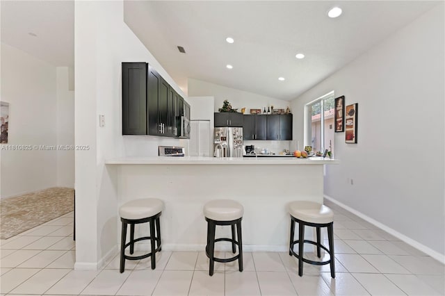 6421 Lake Tern Ln, Coconut Creek, FL 33073 - kitchen featuring stainless steel appliances, recessed lighting, a peninsula, light countertops, and a kitchen breakfast bar