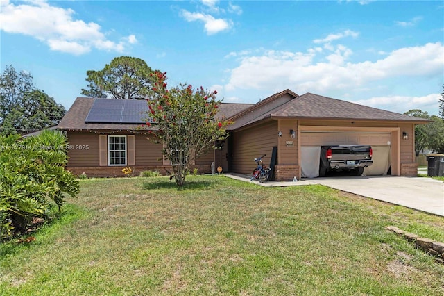 817 Helm Ave NW, Palm Bay, FL 32907 - ranch-style home featuring brick siding, concrete driveway, a garage, roof mounted solar panels, and a front yard
