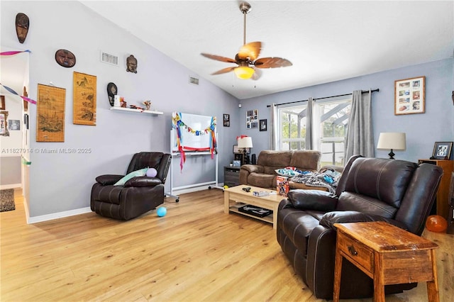 817 Helm Ave NW, Palm Bay, FL 32907 - living room featuring vaulted ceiling, light wood-type flooring, and ceiling fan