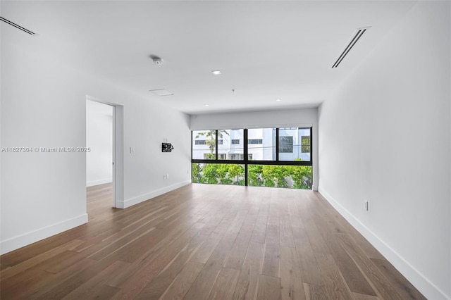 200 Sunrise Dr Unit 200C, Key Biscayne, FL 33149 - unfurnished room featuring wood finished floors and a smoke detector