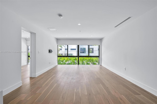 200 Sunrise Dr Unit 200C, Key Biscayne, FL 33149 - empty room with wood finished floors and a smoke detector