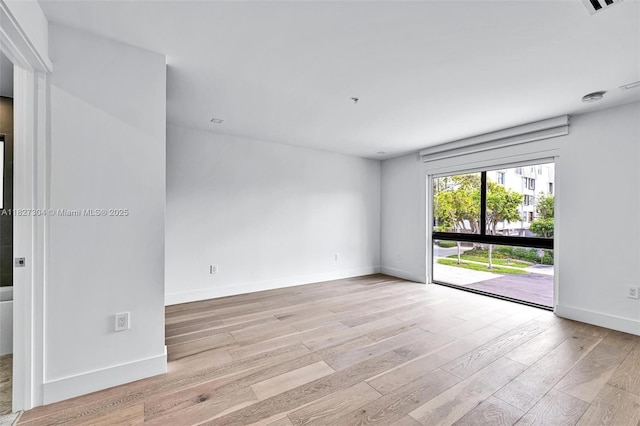 200 Sunrise Dr Unit 200C, Key Biscayne, FL 33149 - empty room with light wood-type flooring and baseboards