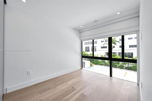 200 Sunrise Dr Unit 200C, Key Biscayne, FL 33149 - unfurnished room with wood finished floors and recessed lighting