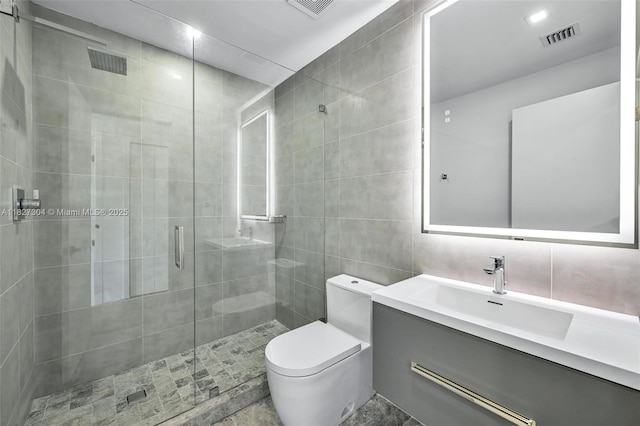 200 Sunrise Dr Unit 200C, Key Biscayne, FL 33149 - full bathroom with vanity, a stall shower, tile walls, and baseboard heating
