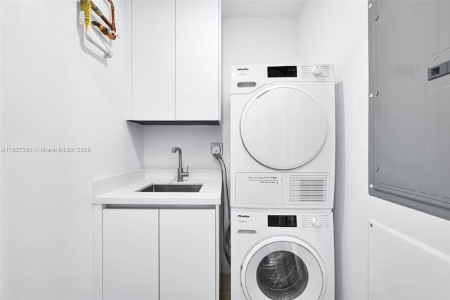 200 Sunrise Dr Unit 200C, Key Biscayne, FL 33149 - washroom with stacked washer / drying machine and cabinet space