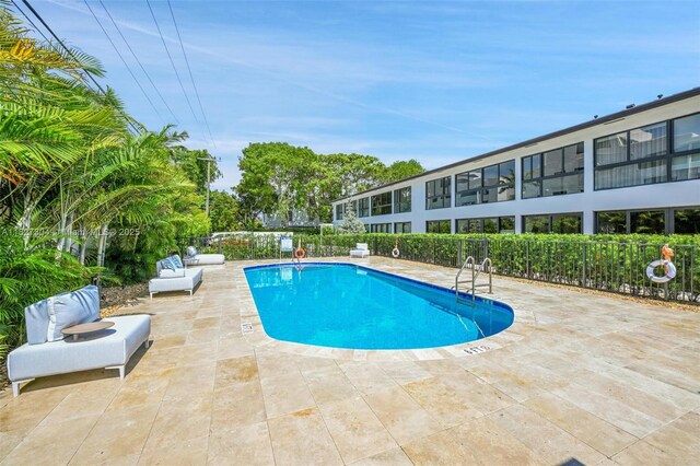 200 Sunrise Dr Unit 200C, Key Biscayne, FL 33149 - community pool featuring a patio