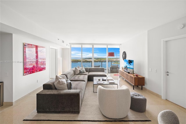 450 Alton Rd Unit 2705, Miami Beach, FL 33139 - living area featuring a wall of windows and light tile patterned floors