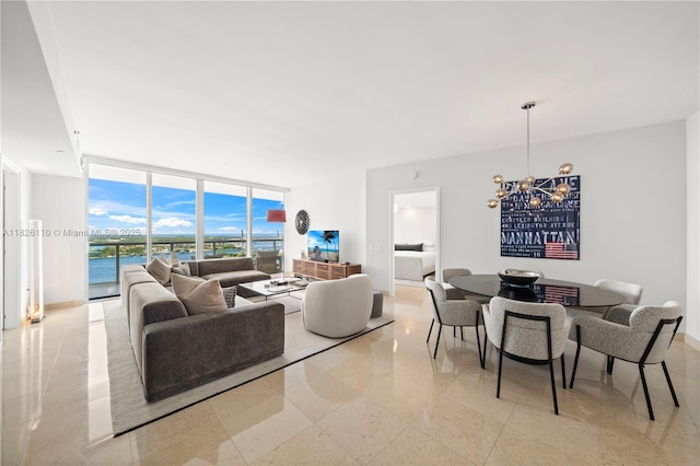 450 Alton Rd Unit 2705, Miami Beach, FL 33139 - living room featuring floor to ceiling windows and a chandelier