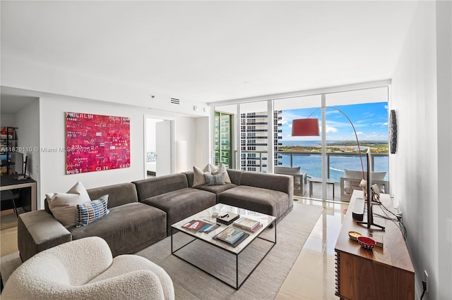 450 Alton Rd Unit 2705, Miami Beach, FL 33139 - living room with a water view, a wall of windows, and light tile patterned flooring