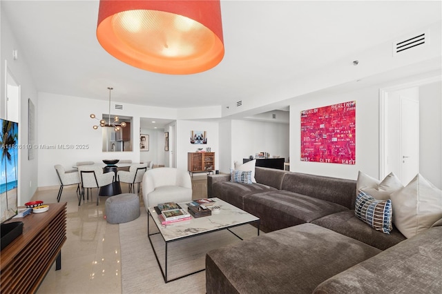450 Alton Rd Unit 2705, Miami Beach, FL 33139 - living area with a chandelier and marble finish floors