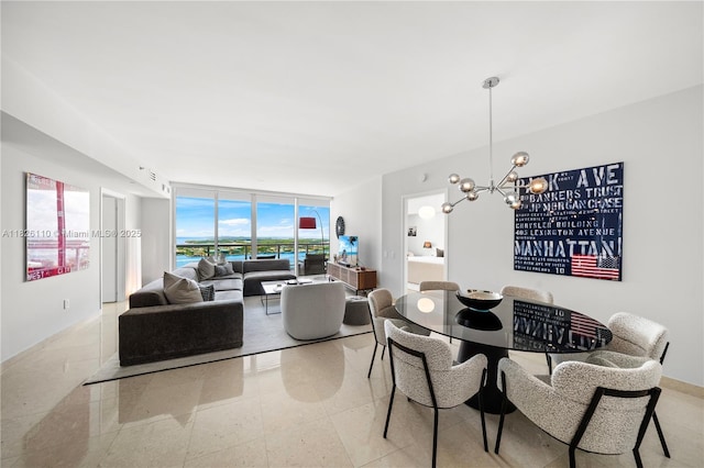 450 Alton Rd Unit 2705, Miami Beach, FL 33139 - dining area featuring a wall of windows and a chandelier