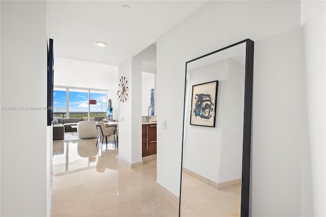 450 Alton Rd Unit 2705, Miami Beach, FL 33139 - hallway with baseboards and light tile patterned floors
