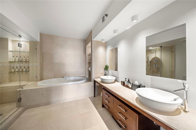 450 Alton Rd Unit 2705, Miami Beach, FL 33139 - bathroom with a garden tub, double vanity, a shower stall, and tile patterned floors