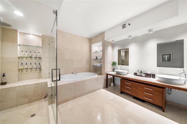 450 Alton Rd Unit 2705, Miami Beach, FL 33139 - bathroom with a stall shower, a bath, double vanity, and tile patterned flooring