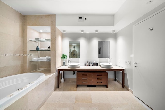 450 Alton Rd Unit 2705, Miami Beach, FL 33139 - full bath featuring a garden tub, double vanity, and tile patterned flooring