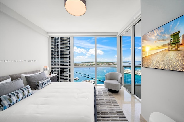 450 Alton Rd Unit 2705, Miami Beach, FL 33139 - bedroom with floor to ceiling windows, multiple windows, and access to outside