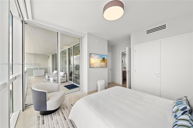 450 Alton Rd Unit 2705, Miami Beach, FL 33139 - bedroom with access to exterior and a wall of windows