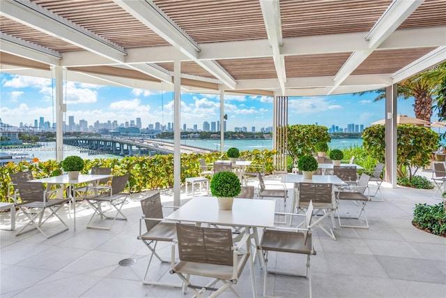 450 Alton Rd Unit 2705, Miami Beach, FL 33139 - view of patio featuring outdoor dining space, a view of skyline, and a water view