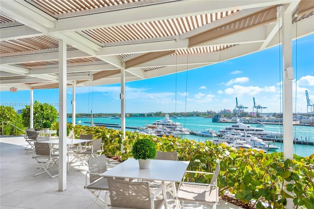 450 Alton Rd Unit 2705, Miami Beach, FL 33139 - view of patio featuring outdoor dining area and a water view
