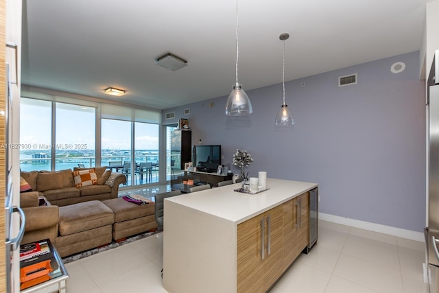 2020 N Bayshore Dr Unit 2005, Miami, FL 33137 - kitchen featuring decorative light fixtures, light countertops, modern cabinets, a center island, and expansive windows