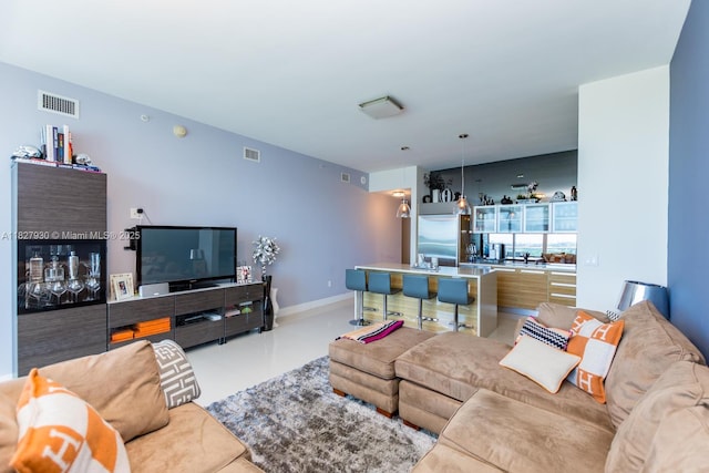 2020 N Bayshore Dr Unit 2005, Miami, FL 33137 - living room featuring baseboards and finished concrete flooring