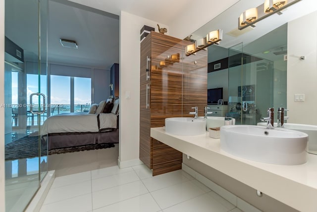 2020 N Bayshore Dr Unit 2005, Miami, FL 33137 - full bathroom featuring a stall shower, double vanity, tile patterned flooring, and ensuite bathroom