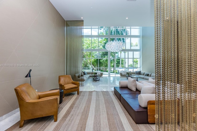 2020 N Bayshore Dr Unit 2005, Miami, FL 33137 - living room with floor to ceiling windows, a chandelier, and recessed lighting