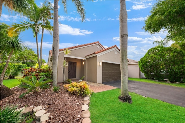 4361 Mahogany Ridge Dr, Weston, FL 33331 - view of front facade with stucco siding, a tiled roof, a garage, asphalt driveway, and a front lawn