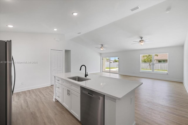 1119 NW 19th St, Cape Coral, FL 33993 - kitchen with appliances with stainless steel finishes, light wood-type flooring, white cabinets, light countertops, and lofted ceiling