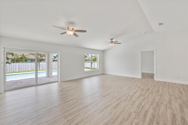 1119 NW 19th St, Cape Coral, FL 33993 - spare room featuring a ceiling fan, vaulted ceiling, and light wood finished floors