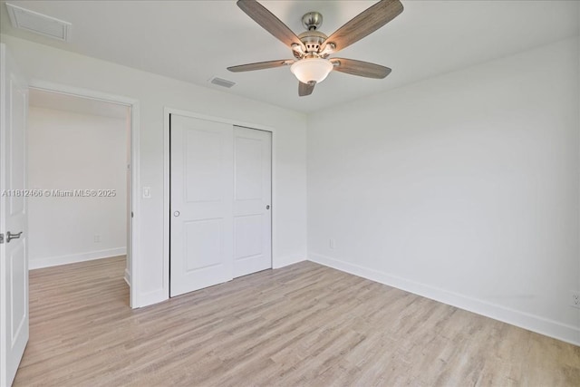 1119 NW 19th St, Cape Coral, FL 33993 - unfurnished bedroom with light wood finished floors, a closet, and a ceiling fan