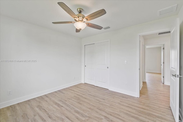 1119 NW 19th St, Cape Coral, FL 33993 - spare room featuring light wood finished floors, ceiling fan, and attic access