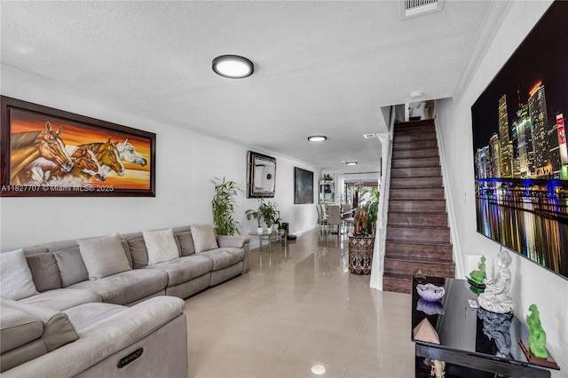 2260 SW 84th Way, Miramar, FL 33025 - living room with stairs, a textured ceiling, and tile patterned flooring