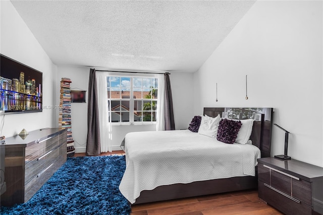2260 SW 84th Way, Miramar, FL 33025 - bedroom with a textured ceiling and wood finished floors