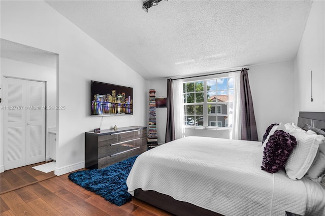 2260 SW 84th Way, Miramar, FL 33025 - bedroom featuring wood finished floors, a textured ceiling, and lofted ceiling