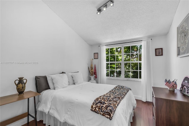 2260 SW 84th Way, Miramar, FL 33025 - bedroom featuring a textured ceiling, dark wood-style floors, and lofted ceiling