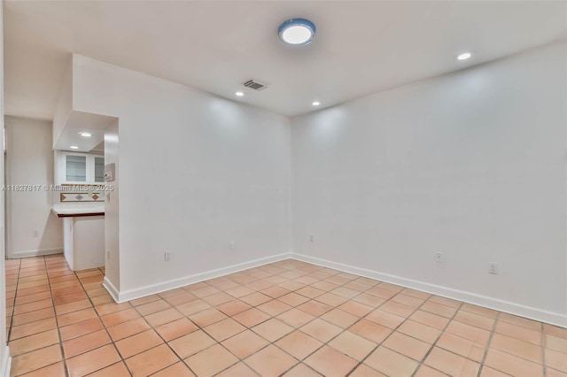 3136 Virginia St, Miami, FL 33133 - empty room with recessed lighting and light tile patterned floors