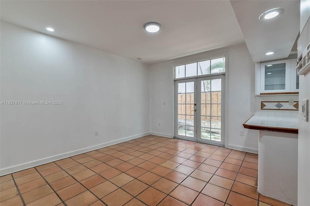 3136 Virginia St, Miami, FL 33133 - spare room with french doors, recessed lighting, and light tile patterned floors