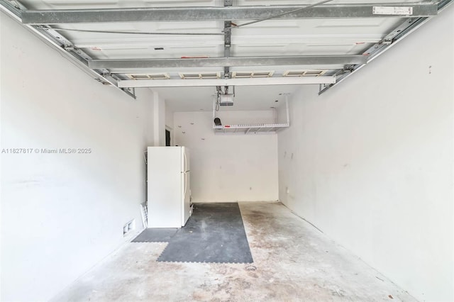 3136 Virginia St, Miami, FL 33133 - garage featuring freestanding refrigerator and a garage door opener