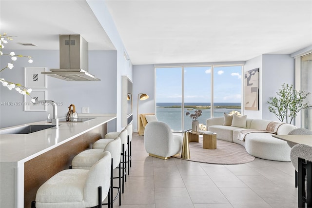 495 Brickell Ave Unit 3901, Miami, FL 33131 - living area featuring a wall of windows, a water view, and tile patterned flooring