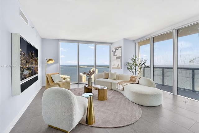 495 Brickell Ave Unit 3901, Miami, FL 33131 - living room featuring floor to ceiling windows, a water view, and tile patterned floors